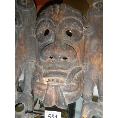 551 - An old carved wood tribal mask.