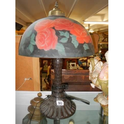 563 - A good quality table lamp with rose decorated glass shade. COLLECT ONLY.