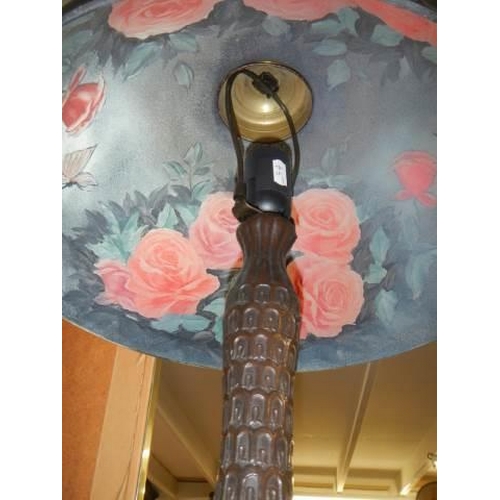 563 - A good quality table lamp with rose decorated glass shade. COLLECT ONLY.