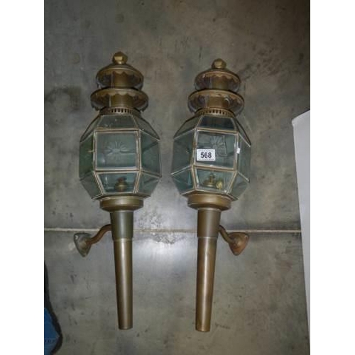 568 - A pair of late 20th century brass carriage lamps.