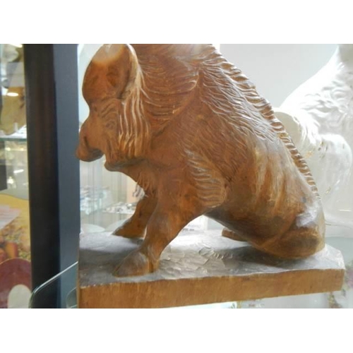 575 - A mid 20th century carved wood boar.