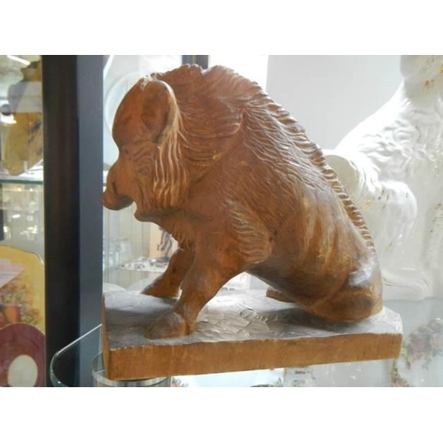 575 - A mid 20th century carved wood boar.