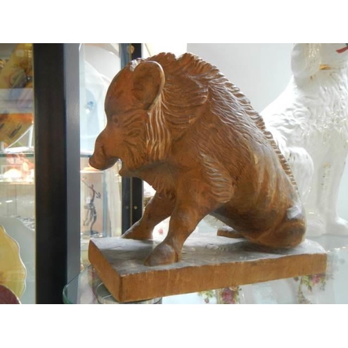 575 - A mid 20th century carved wood boar.