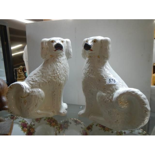 576 - A pair of early 20th century Staffordshire spaniels.