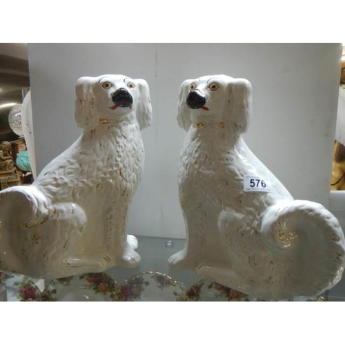 576 - A pair of early 20th century Staffordshire spaniels.