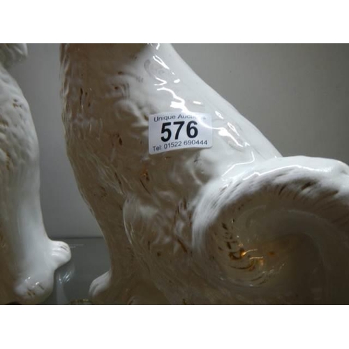 576 - A pair of early 20th century Staffordshire spaniels.