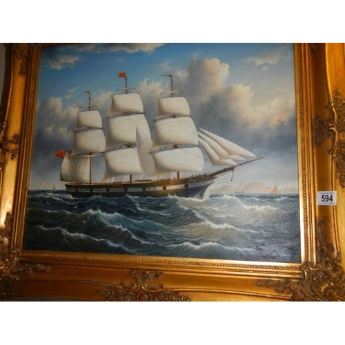 594 - A gilt framed oil on canvas of a sailing ship, Frame 82 x 71 cm, image 60 x 50 cm, COLLECT ONLY.