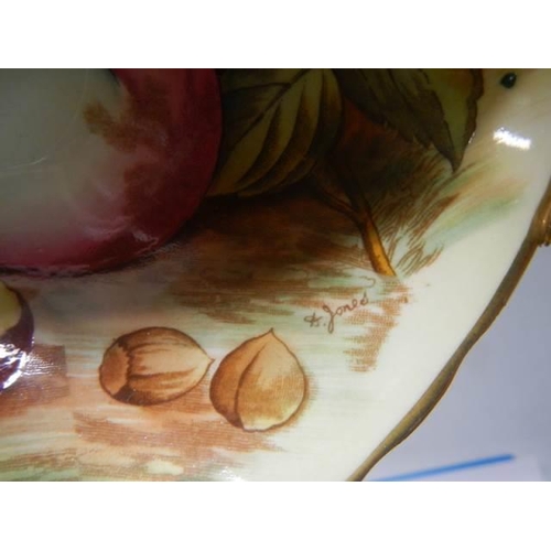 644 - An Aynsley Orchard Gold Apricot cup and saucer with gold footing signed D Jones.