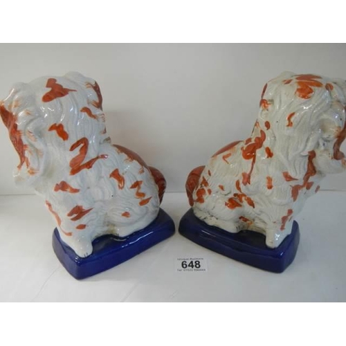 648 - A pair of modern Victorian style Staffordshire spaniels