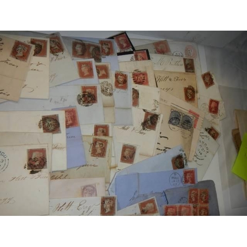 679 - Approximately 47 penny red stamps on postmarked envelopes.