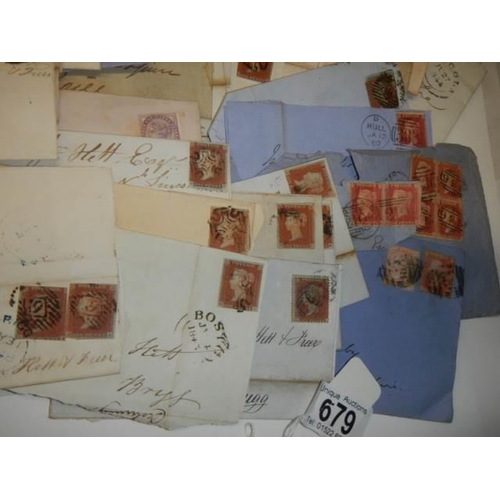 679 - Approximately 47 penny red stamps on postmarked envelopes.