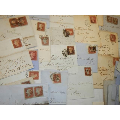 680 - Approximately 65 penny red stamps on postmarked envelopes.