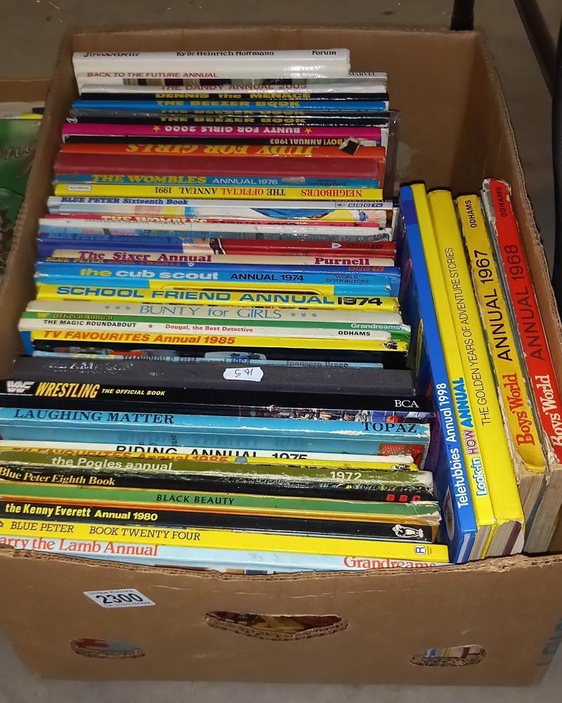 A good lot of annuals and books including Boys World, Judy, The Wombles ...