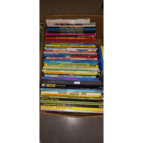 2300 - A good lot of annuals and books including Boys World, Judy, The Wombles, The Beezer etc