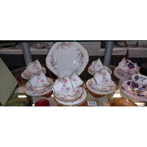 2316 - A 20 piece Paragon tea set and Royal Albert set of 3 trios