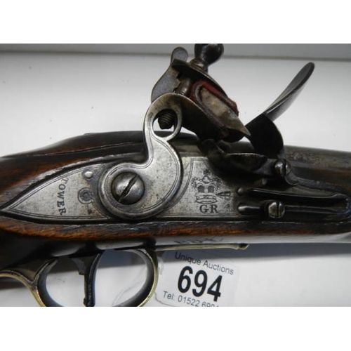 694 - A Tower of London flintlock pistol in excellent condition for its age. (early King George Crown mark... 