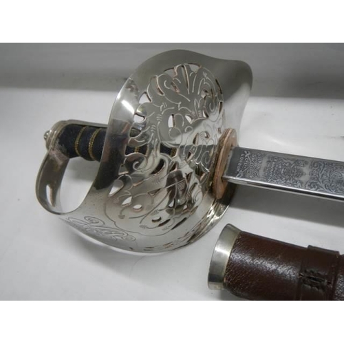 697 - An old cavalry sword in original scabbard. COLLECT ONLY