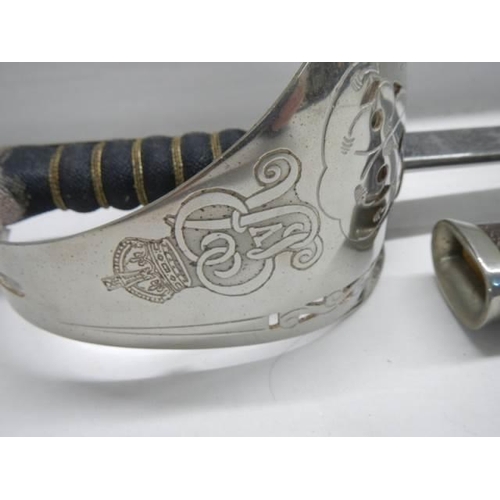 697 - An old cavalry sword in original scabbard. COLLECT ONLY