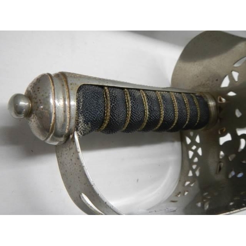 697 - An old cavalry sword in original scabbard. COLLECT ONLY