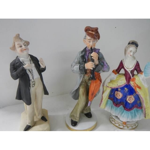 703 - Four good continental porcelain figures.