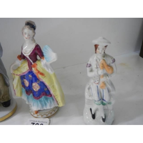 703 - Four good continental porcelain figures.