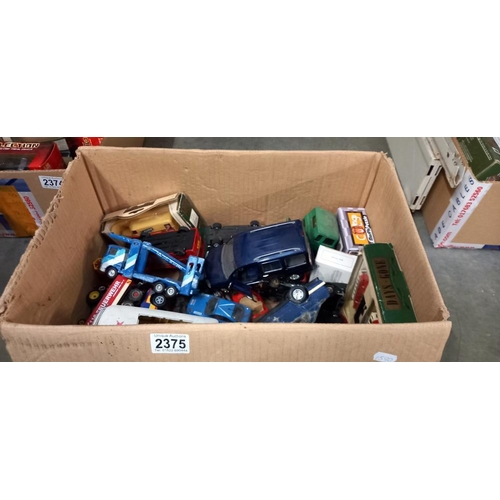 2375 - A large box of mixed play worn diecast including Corgi, Dinky, Britain's etc