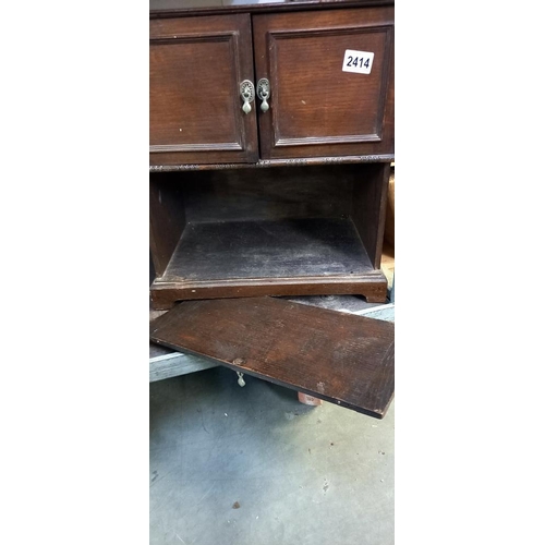 2414 - A 1930's oak 2 door writing box/cabinet with removable front panel 42cm x 28 cm x height 46cm