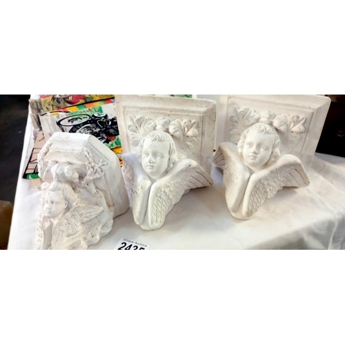 2435 - 3 small plaster wall mounts with Cherub faces