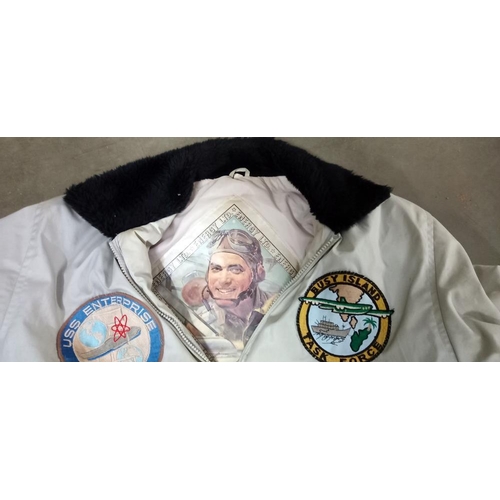 2476 - A Energy aviation limited jacket, size small with US Naval patches in need of cleaning