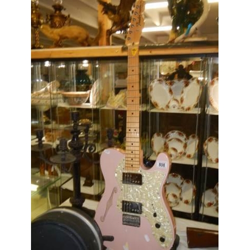 808 - A Fender Telecaster thinline shell pink guitar with black hard case.