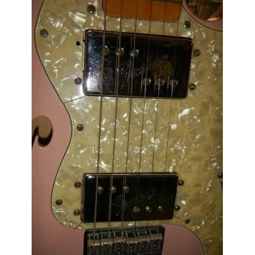 808 - A Fender Telecaster thinline shell pink guitar with black hard case.