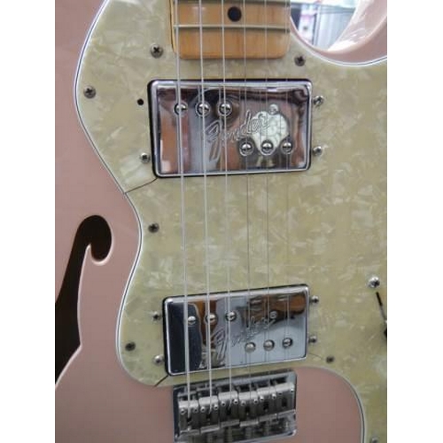 808 - A Fender Telecaster thinline shell pink guitar with black hard case.