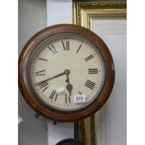 819 - A circular mahogany school clock, in working order.