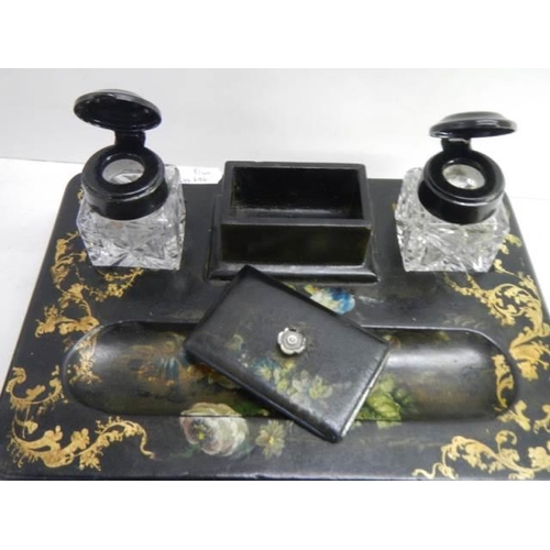 828 - A papier mache' desk tray with painted floral design.