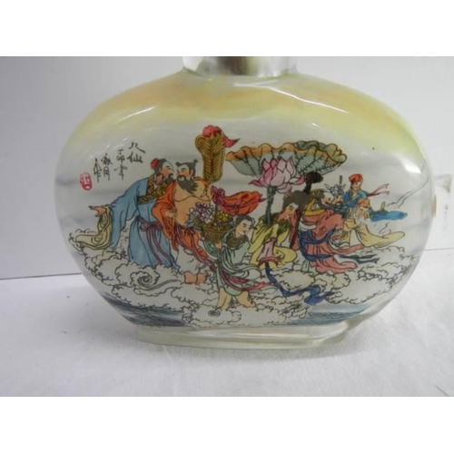 839 - Two large Chinese inside painted moonflask glass table snuff bottles: one with a bridge/harbour scen... 