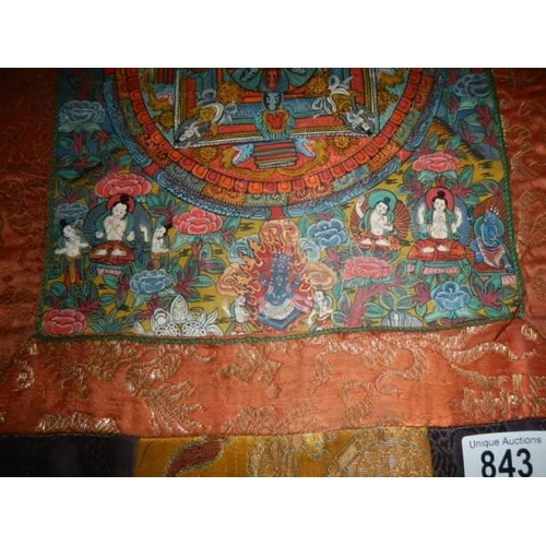 843 - . A Tibetan Buddhist hand-painted mandala thangka set in silk brocade. Images include detailed manif... 