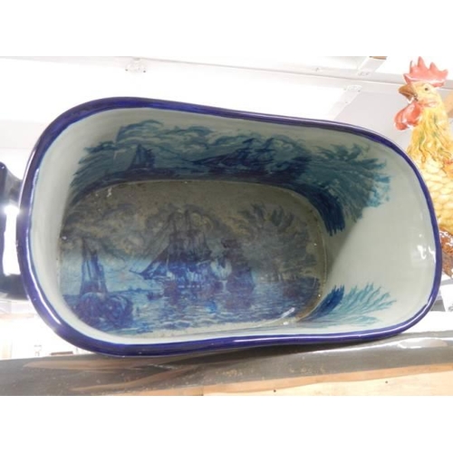 853 - A 20th century porcelain blue and white foot bath featuring ships on inside and out. COLLECT ONLY.