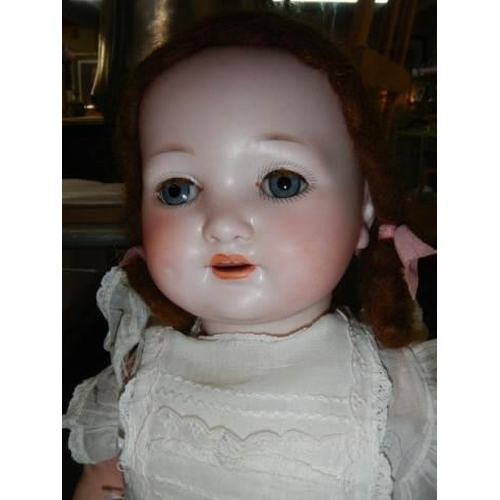 866 - An Armand Marseille bisque headed doll, model No 985 A.6.M, 48 cm / 19