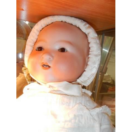 869 - An Armand Marseille bisque headed baby doll.  351/6K