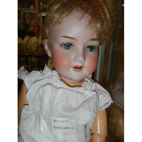 873 - An Armand Marseille bisque headed doll, model No. 390, A.4.M. 53 cm / 21 