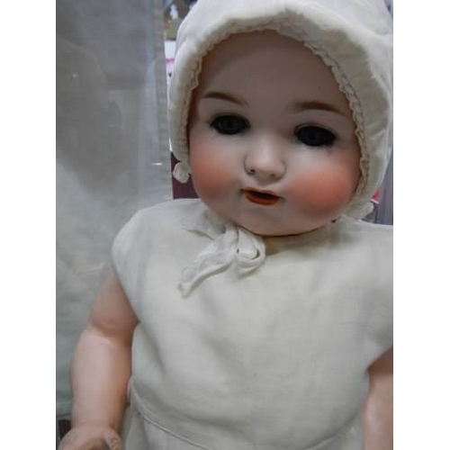 880 - An Armand Marseille bisque headed doll, Model 990, a 13 M.