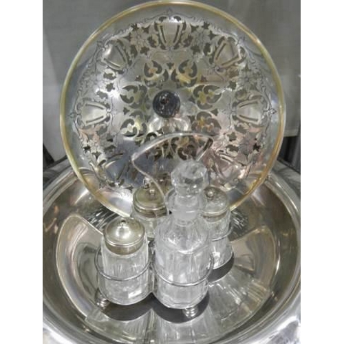 887 - A silver plate cake tray, fretted dish and condiment set,.