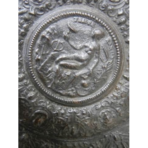 912 - A cast metal embossed plate.