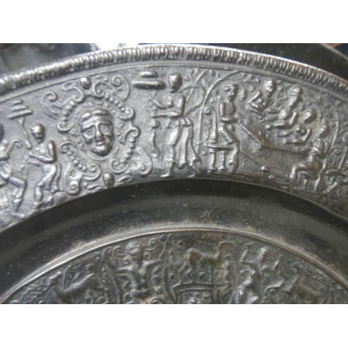 912 - A cast metal embossed plate.