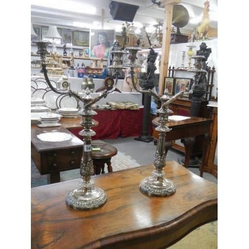 946 - A pair of early Victorian Sheffield plate candelabra.