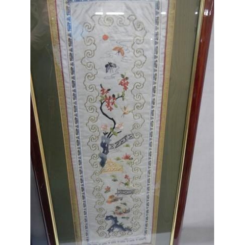 958 - A pair of framed and glazed Chinese embroidered silks, COLLECT ONLY.