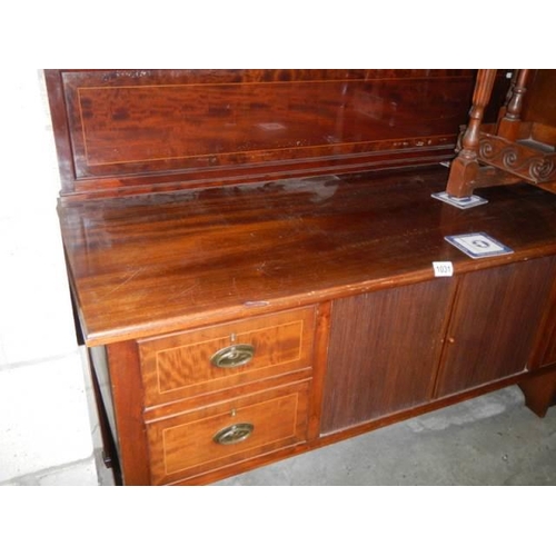 1031 - A late Victorian mahogany sideboard with two shelves and four doors. COLLECT ONLY.