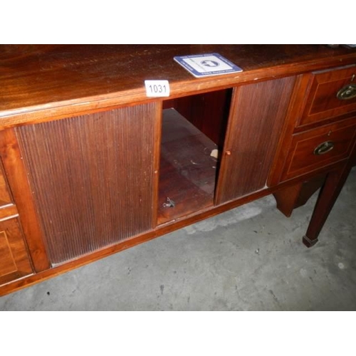 1031 - A late Victorian mahogany sideboard with two shelves and four doors. COLLECT ONLY.