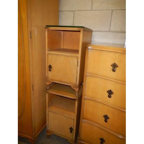 1049 - A four piece mid 20th century bedroom suite comprising wardrobe, 2 over 3 chest of drawers and 2 bed... 