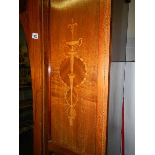 1053 - An Edwardian mahogany inlaid drawer base wardrobe with mirrored doors, COLLECT ONLY.